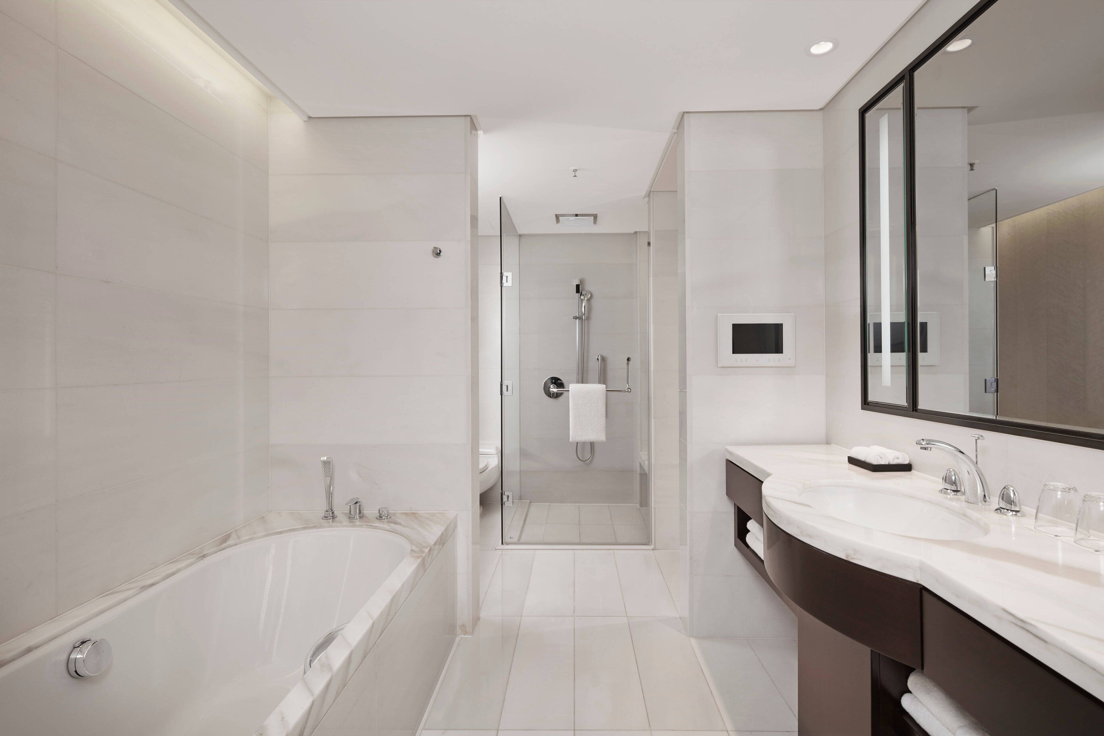 executive suite, 1 king bed, non smoking | bathroom | separate bathtub and shower, rainfall showerhead, hair dryer, bathrobes