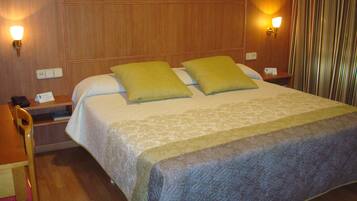 Premium bedding, desk, laptop workspace, blackout curtains