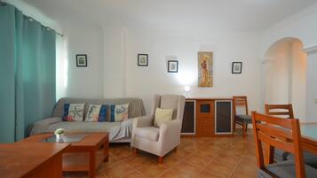 Standard Apartment, 2 Bedrooms | Living area | 45-inch flat-screen TV with satellite channels, TV