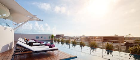 Outdoor pool, open 8 AM to 10 PM, pool umbrellas, sun loungers