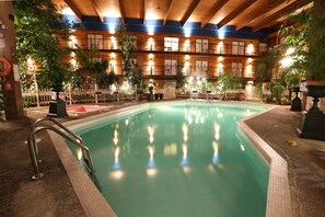 An indoor swimming pool with a wooden ceiling and multiple balconies. - Prestige Vernon Lodge and Conference Centre (Vernon)