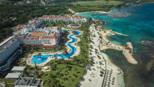 A resort with multiple buildings, a large pool area, and a beach. - Bahia Principe Escape Runaway Bay - Hyatt Inclusive Collection - Adults Only - All Inclusive (Runaway Bay)