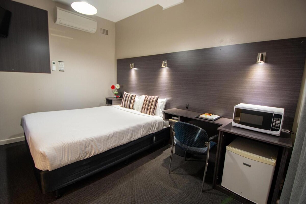 Blackout drapes, iron/ironing board, WiFi (free), bed sheets