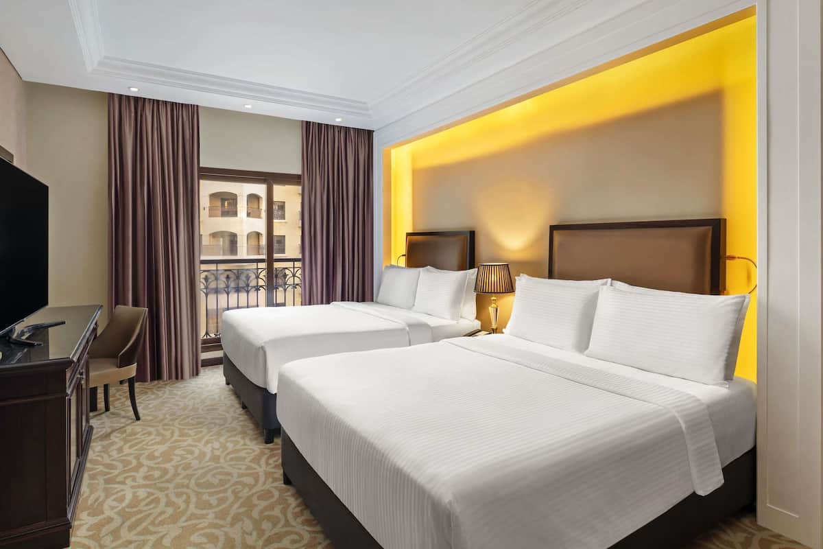 Premium bedding, memory foam beds, minibar, in-room safe