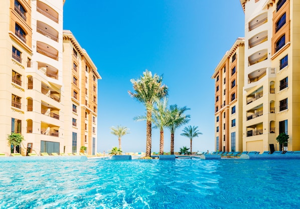 2 indoor pools, outdoor pool, open 8:00 AM to 6:00 PM, pool umbrellas