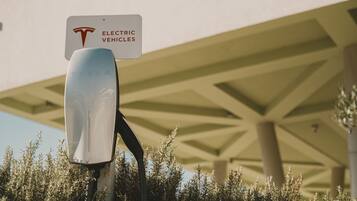 A sign indicating a charging station for electric vehicles.