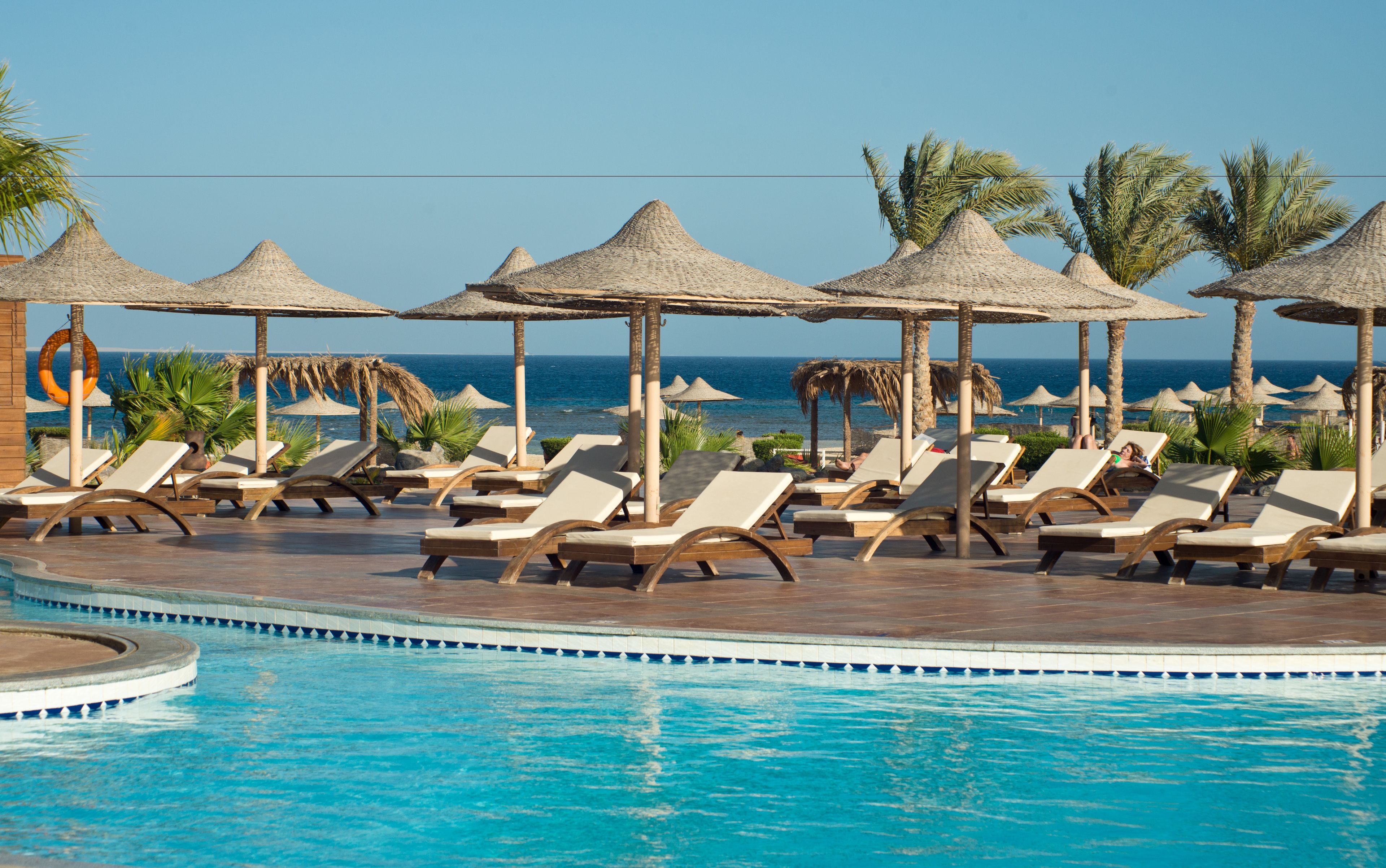 Outdoor pool, pool umbrellas, sun loungers