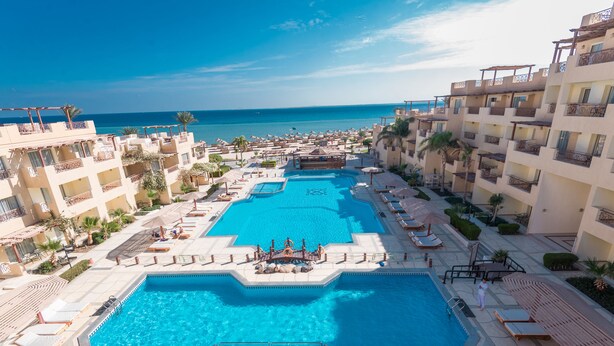 A resort with multiple swimming pools, a central water feature, and a beach view. - Imperial Shams Abu Soma - All inclusive (Safaga)