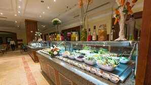 A buffet with various food items and condiments. - Imperial Shams Abu Soma - All inclusive (Safaga)