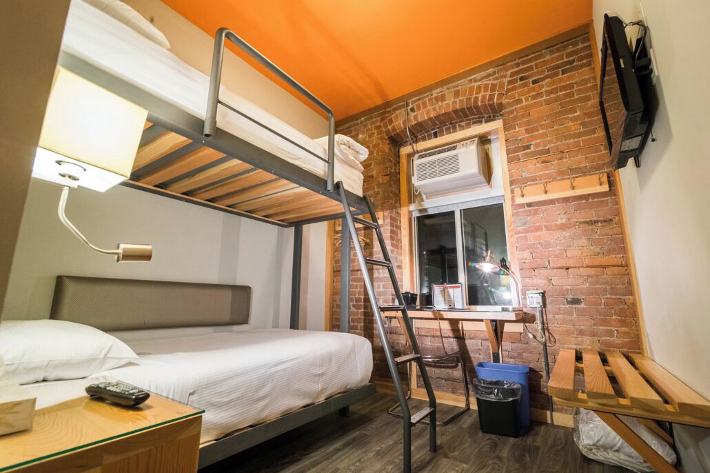 budget twin | down duvets, desk, laptop workspace, iron/ironing board