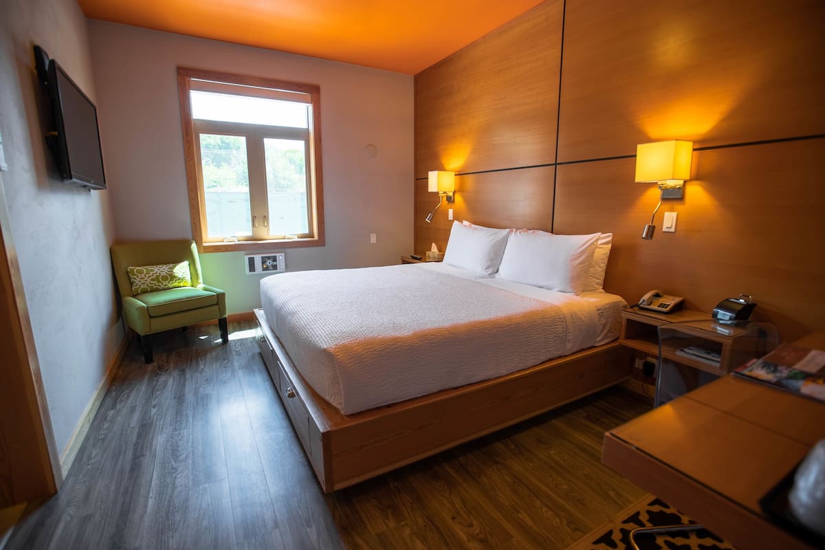 Down duvets, desk, laptop workspace, iron/ironing board