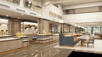 A spacious hotel lobby with a central reception area, multiple dining tables, and a marble floor.