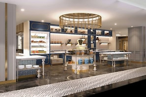 A modern kitchen with marble countertops, built-in shelves, and a central island. - Grand Hotel Preanger, Bandung, a Tribute Portfolio Hotel (Bandung)