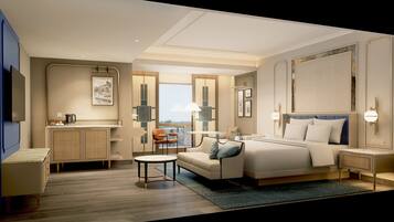 Habitación de hotel con cama, sofá, mesita, escritorio y vistas al exterior.
