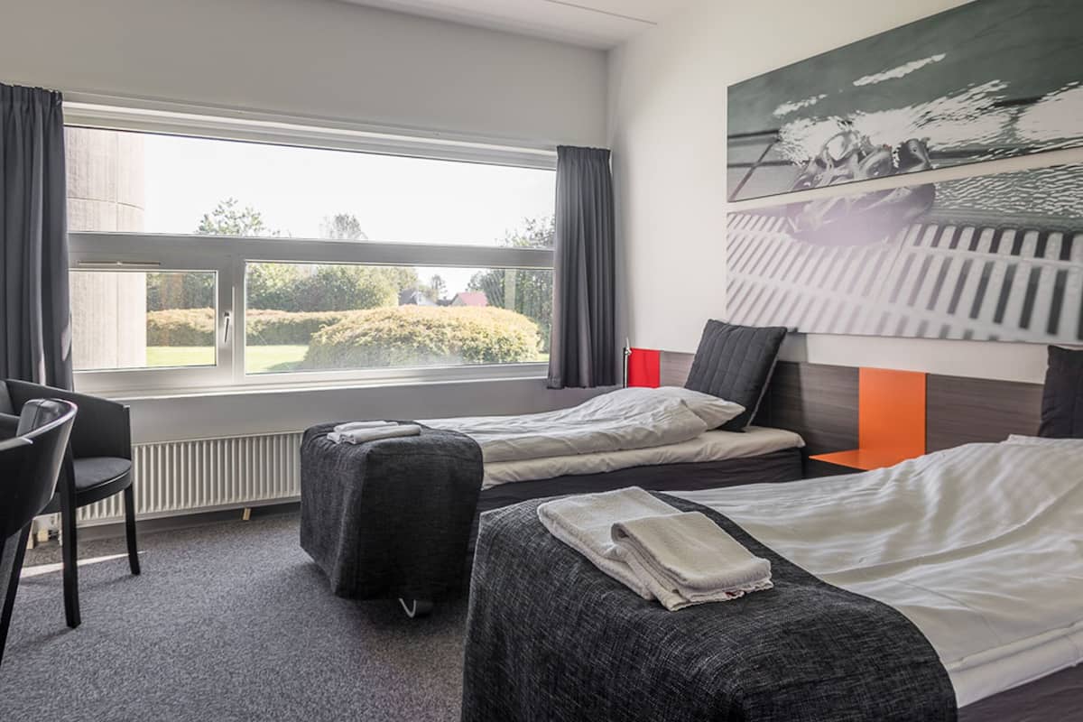 hypo-allergenic bedding, desk, blackout curtains, soundproofing