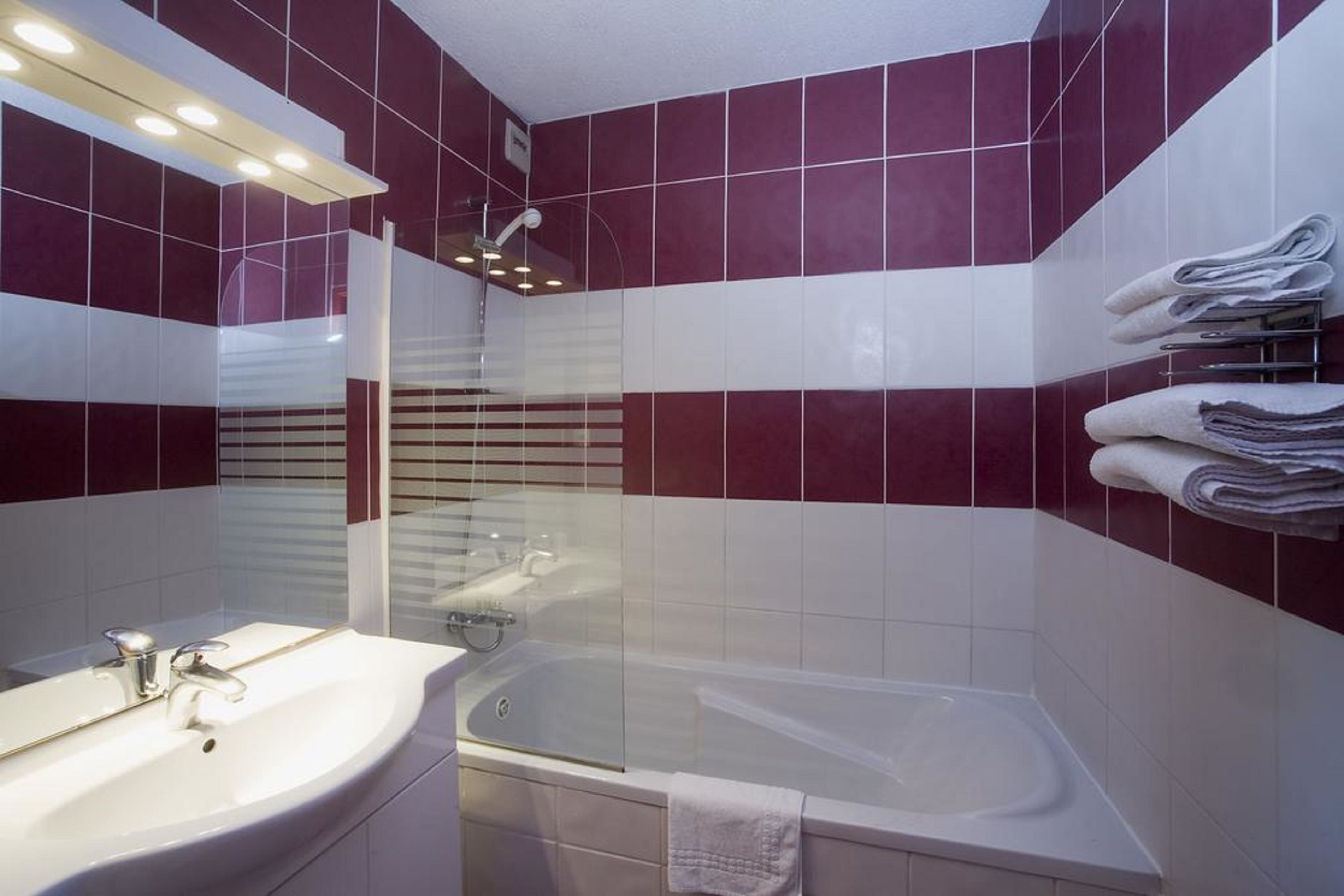 Bathtub, hair dryer, towels