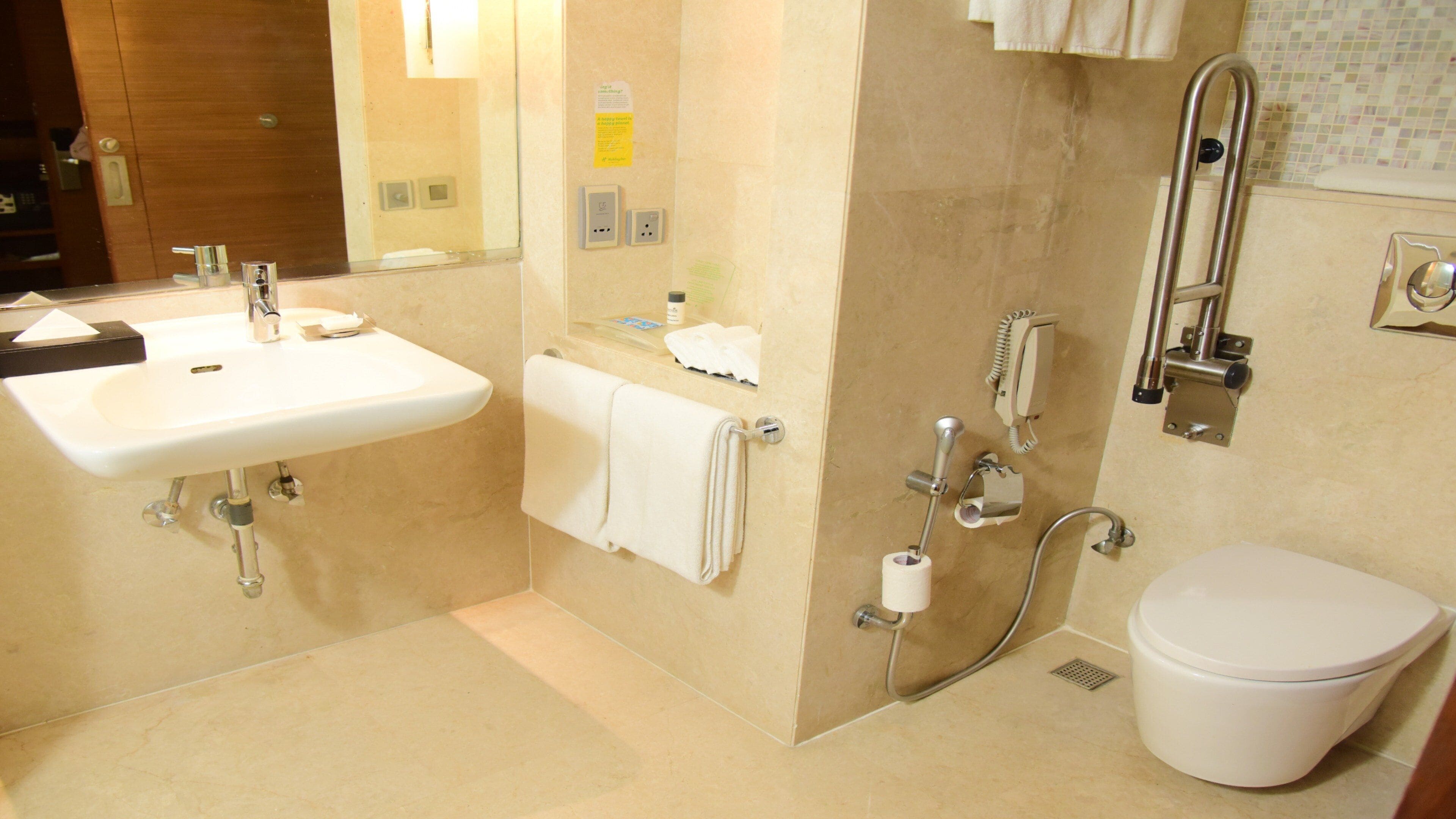 A bathroom with a sink, toilet, and shower.