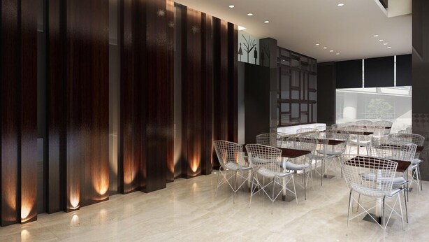 Una sala de conferencias moderna con un panel de madera oscura, sillas blancas tipo estructura de alambre y una gran mesa.