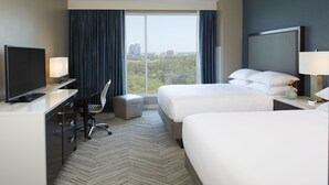 A hotel room with two beds, a desk with a computer, a chair, and a TV. - Hyatt Regency Atlanta Perimeter at Villa Christina (Atlanta)