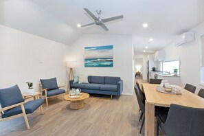 Premium Cabin - Sleeps 6 | Living area | Flat-screen TV, DVD player - Reflections Massy Greene - Holiday Park (Brunswick Heads)