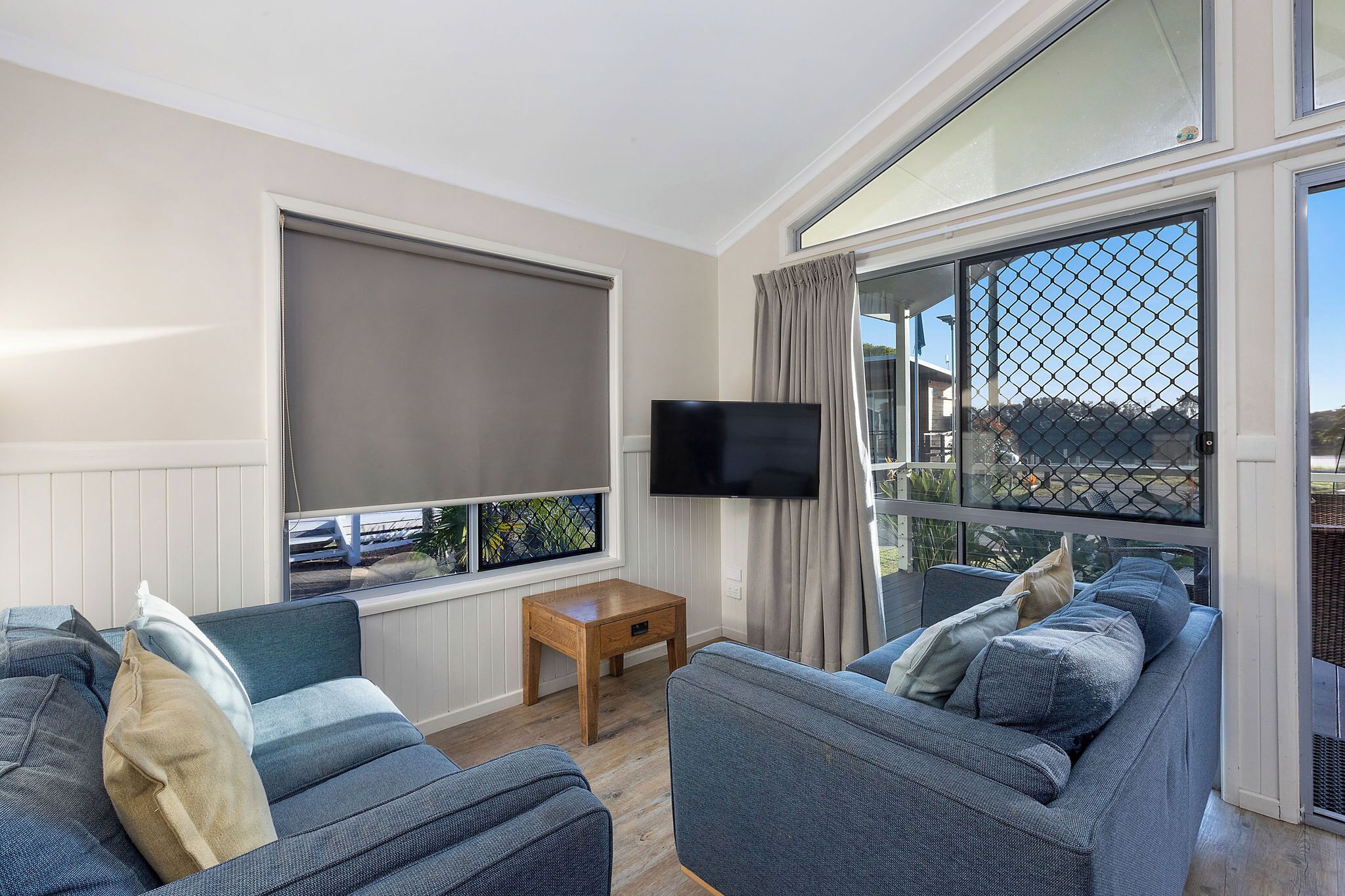 Deluxe Cabin - Sleeps 5 | Living area | Flat-screen TV, DVD player