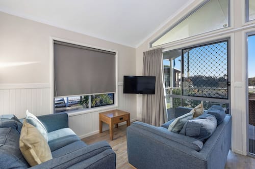 Deluxe Cabin - Sleeps 5 | Living area | Flat-screen TV, DVD player