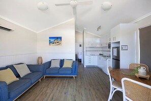 Standard Cabin - Sleeps 4 | Living area | Flat-screen TV, DVD player - Reflections Massy Greene - Holiday Park (Brunswick Heads)