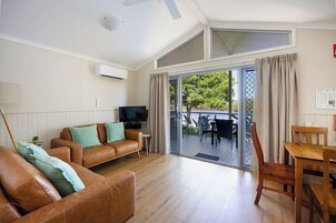 Superior Cabin - Sleeps 4 | Living area | 32-inch TV with digital channels