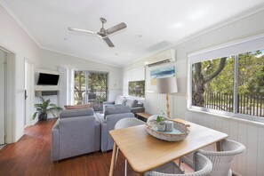 Deluxe Cabin - Sleeps 6 - Dog Friendly | Living area | LCD TV, DVD player - Reflections Lennox Head - Holiday park (Lennox Head)
