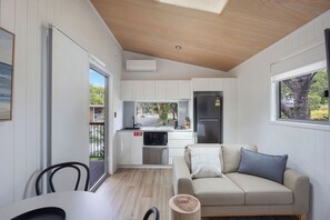 Tiny Home - Sleeps 4 - Dog Friendly | Living area | LCD TV, DVD player - Reflections Lennox Head - Holiday park (Lennox Head)