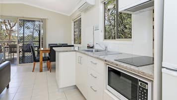 Full-sized fridge, microwave, stovetop, electric kettle