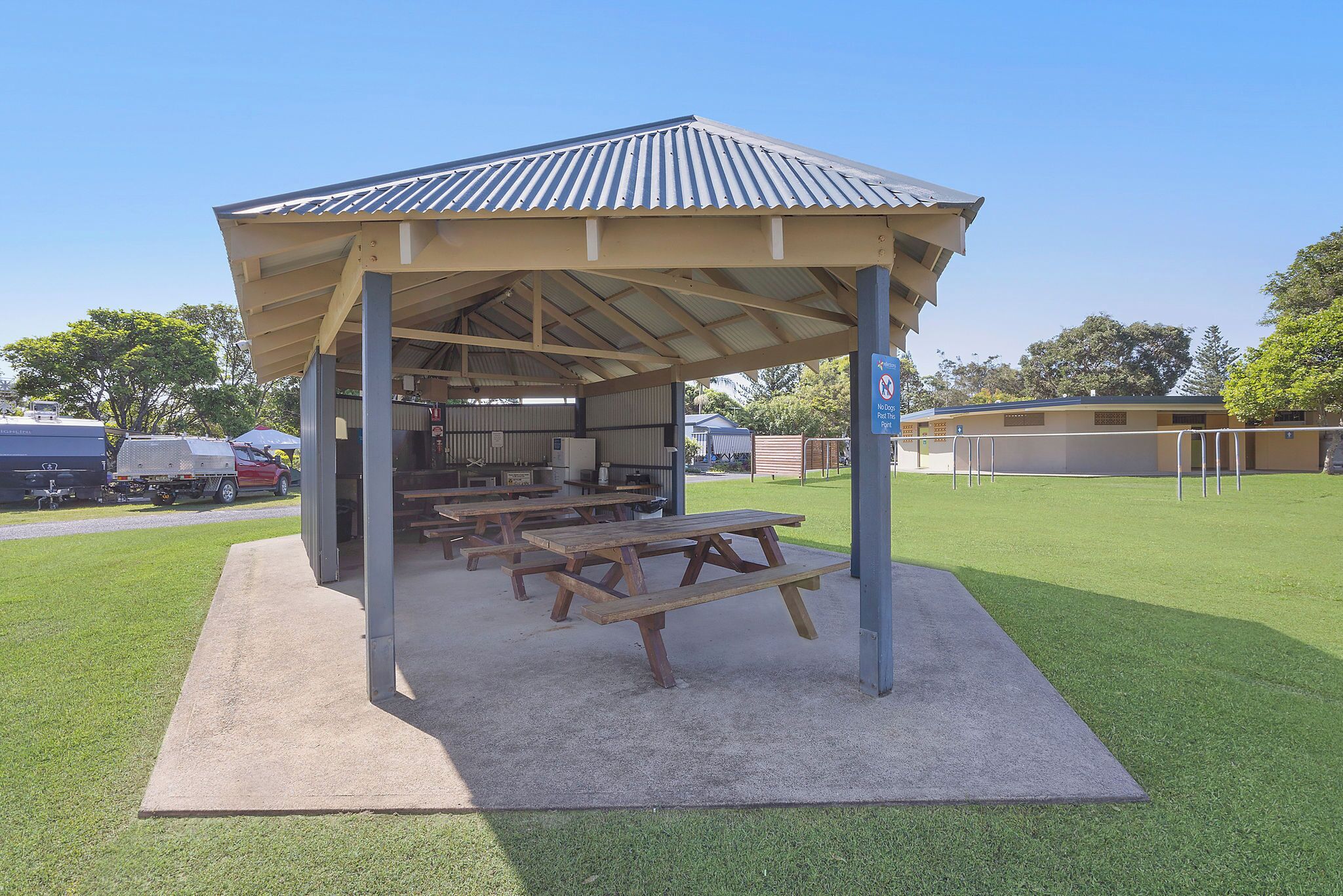 A covered picnic area with tables and a shelter.