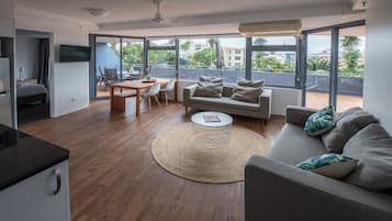 Deluxe Apartment, 1 Bedroom, Courtyard Area | Living area | LCD TV
