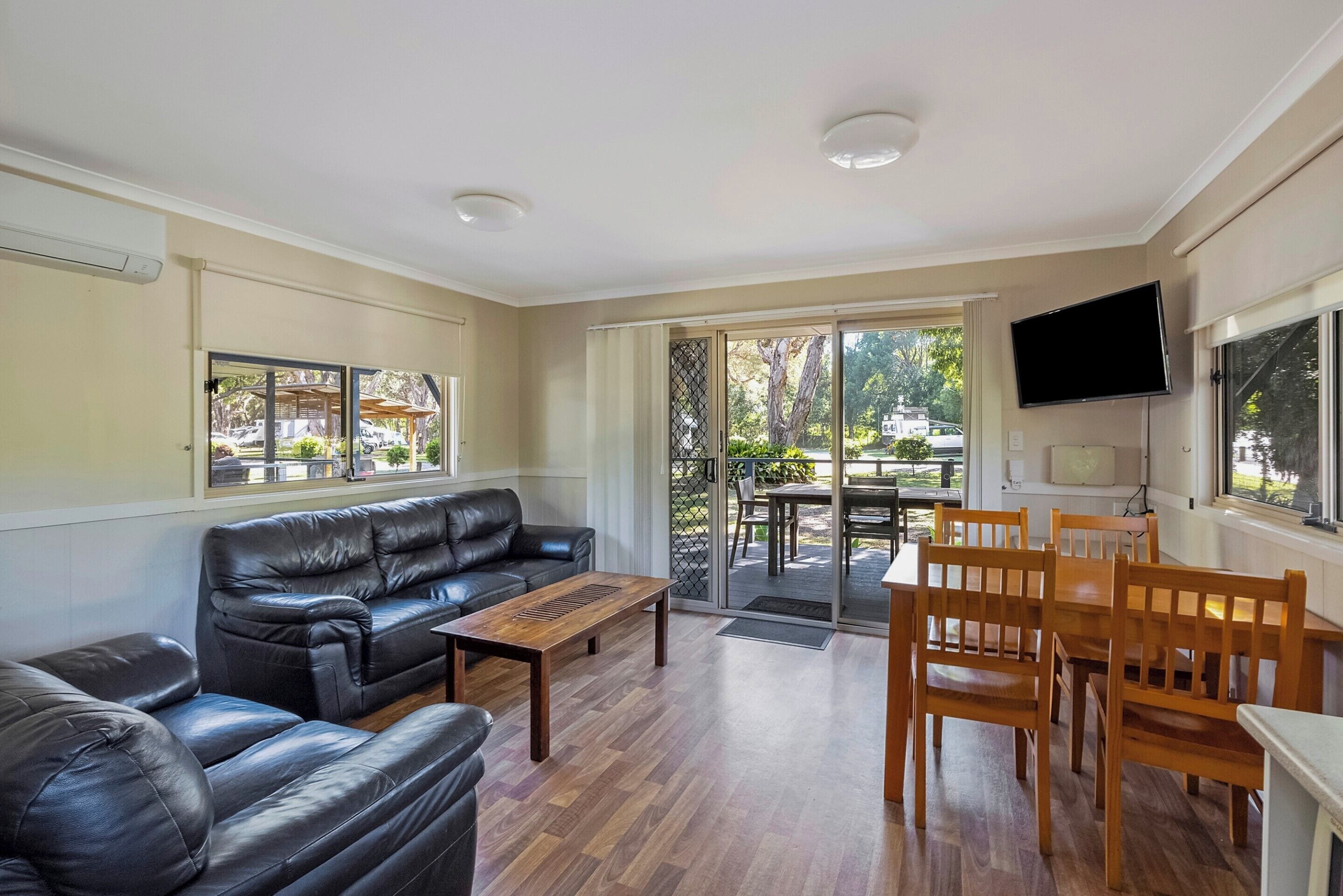 Deluxe Cabin - Sleeps 4 | Living area | 0-cm LCD TV with digital channels, TV