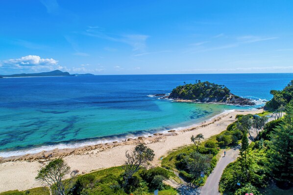On the beach, surfing