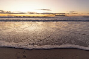 Beach nearby, white sand, beach volleyball