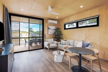 Superior Cabin | Living area. Reflections Hawks Nest - Holiday Park