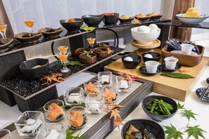 A variety of dishes and drinks arranged on a table, including bowls, glasses, and plates with food items. - Hotel Mystays Sapporo Susukino (Sapporo)