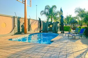 Outdoor pool, open 6:00 AM to 10:00 PM, sun loungers