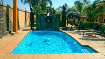 Outdoor pool, open 6:00 AM to 10:00 PM, sun loungers