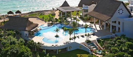 Outdoor pool, open 7:00 AM to 10:00 PM, pool umbrellas, sun loungers