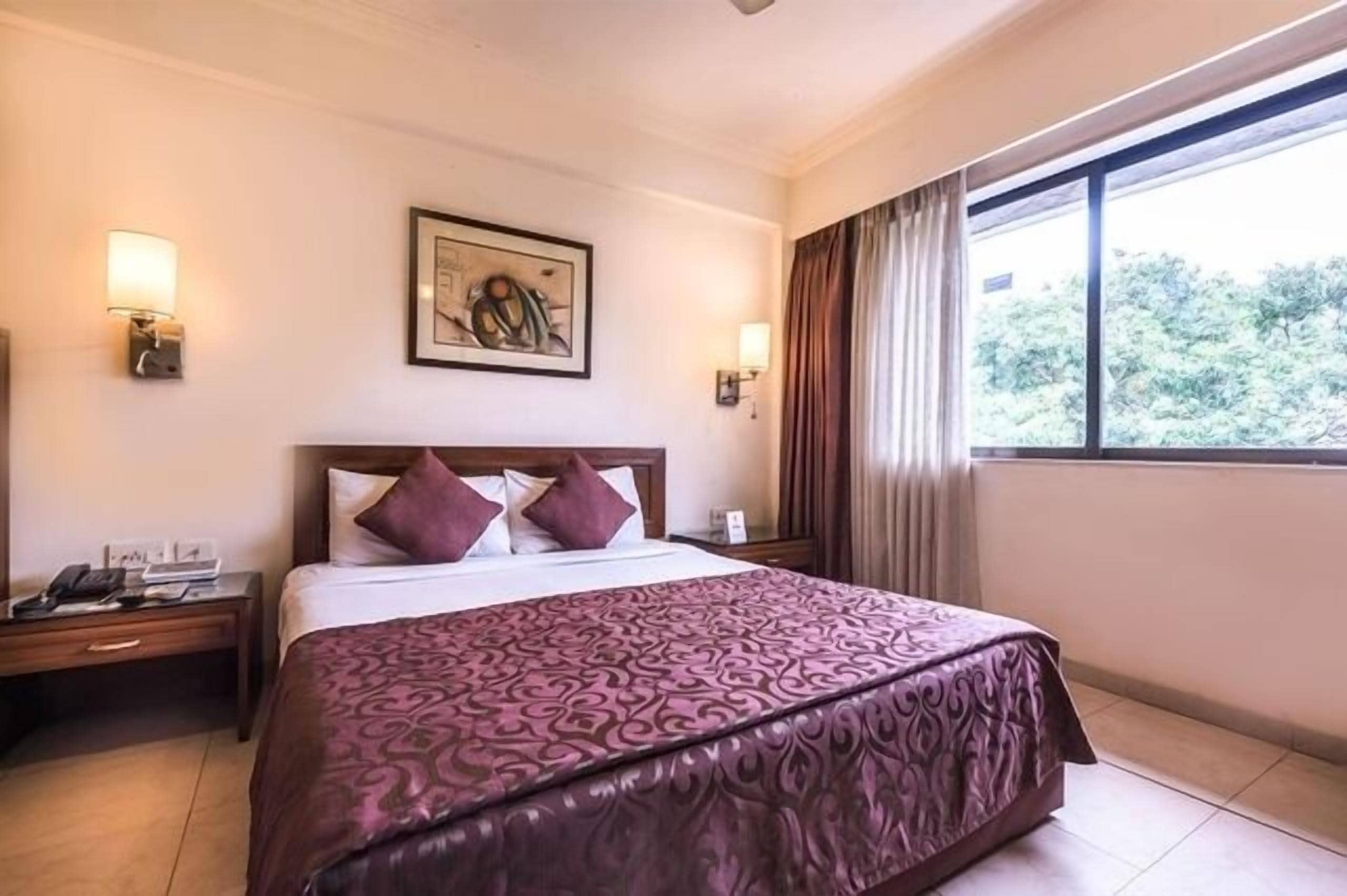 Executive Room | Pillowtop beds, minibar, in-room safe, individually decorated