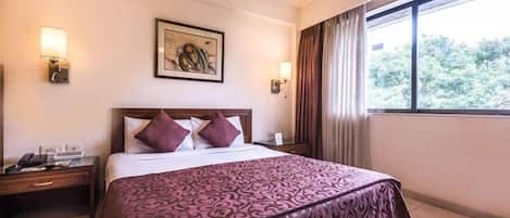 Executive Room | Pillowtop beds, minibar, in-room safe, individually decorated