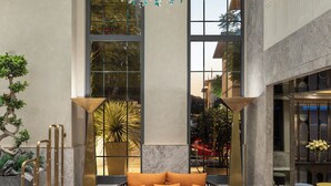 A spacious lobby with a large sofa, two armchairs, a coffee table, and a patterned rug. - The Ritus Hotel Istanbul Sultanahmet, Tapestry Collection by Hilton (Istanbul)