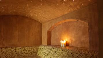 Experience the unique ambiance of this stylish space with a curved ceiling and comfortable seating areas.