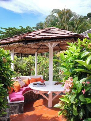 Superior Cottage, Garden Area | Free minibar, in-room safe, iron/ironing board, free WiFi