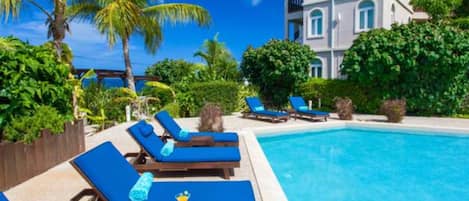 Outdoor pool, pool umbrellas, sun loungers