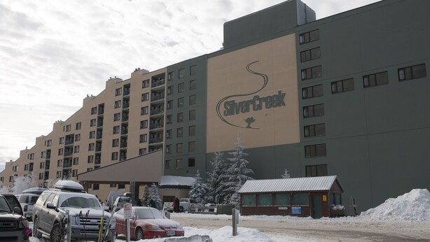 A multi-story hotel with a large sign reading "Silver Creek." - Silver Creek Lodge (Snowshoe)
