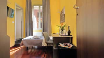 Economy Single Room | Minibar, in-room safe, individually decorated, individually furnished