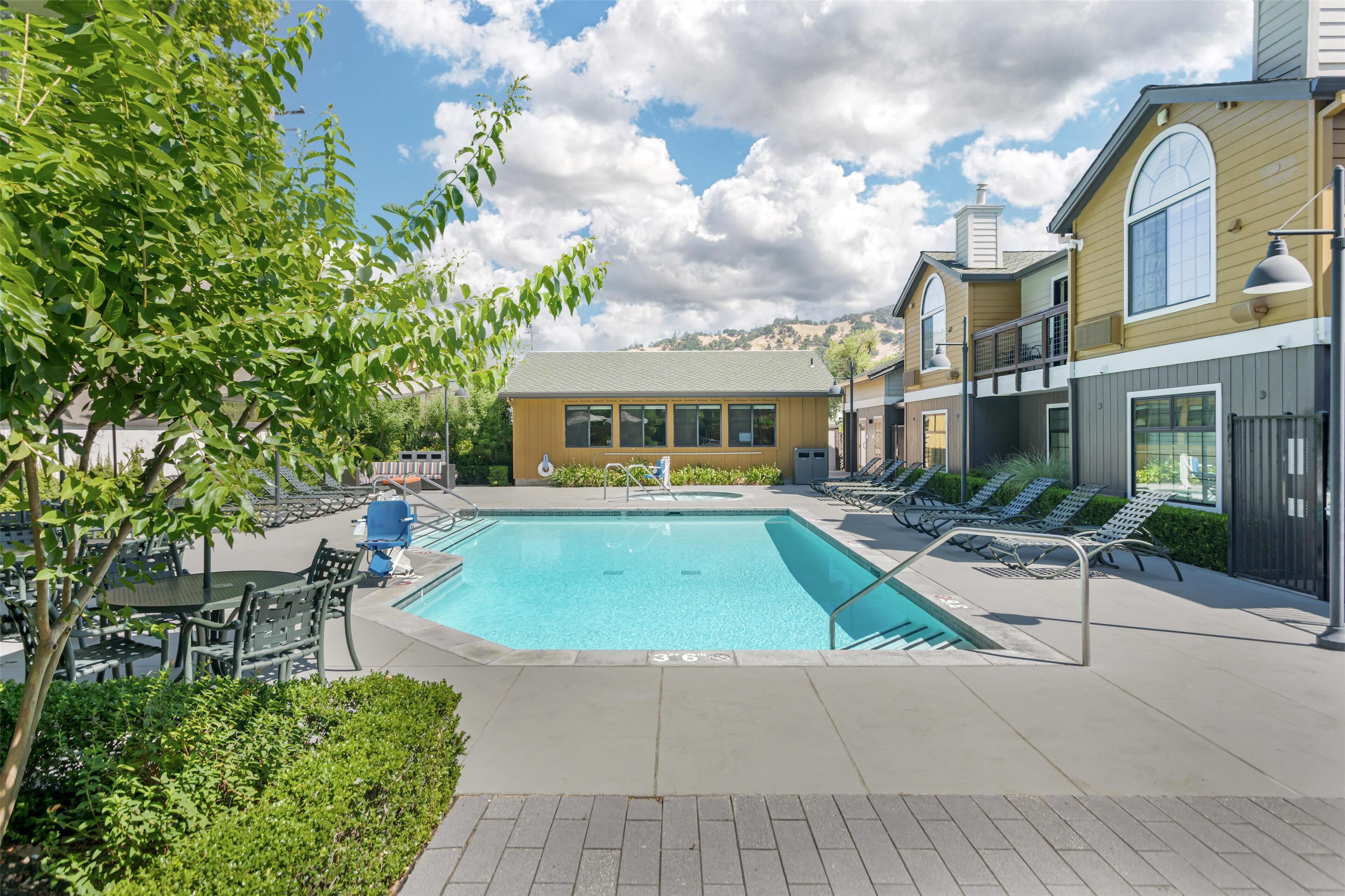 outdoor pool, open 9:00 am to 10:00 pm, pool umbrellas, pool loungers